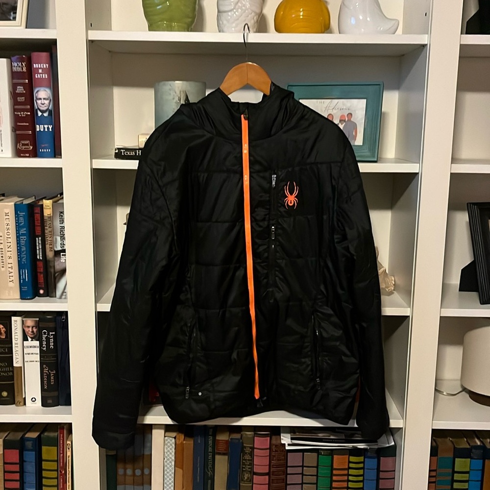 Light weight and warm hooded puffy jacket. Rare black and orange.